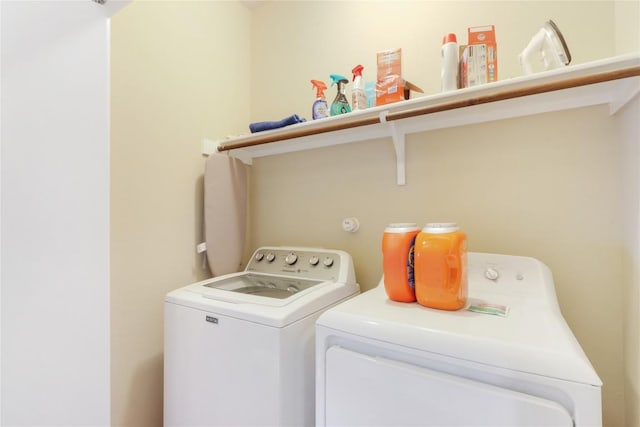 washroom featuring washer and dryer and laundry area