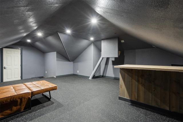 bonus room with vaulted ceiling, recessed lighting, baseboards, and a textured ceiling