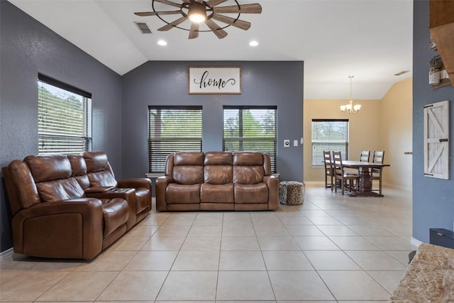 living area featuring visible vents, baseboards, light tile patterned flooring, vaulted ceiling, and ceiling fan with notable chandelier