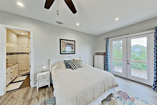 bedroom with visible vents, light wood-type flooring, french doors, ensuite bath, and access to outside