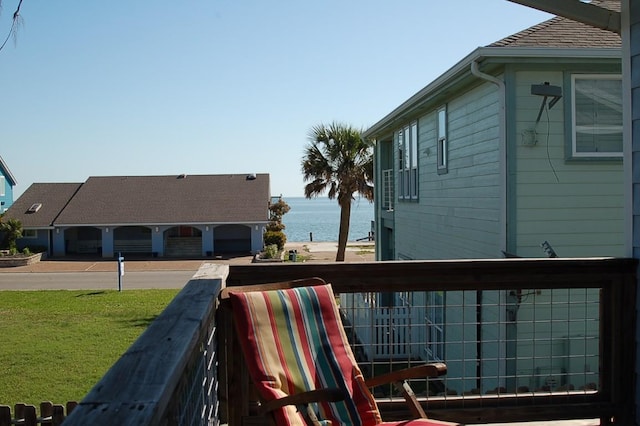 exterior space with a yard and a water view