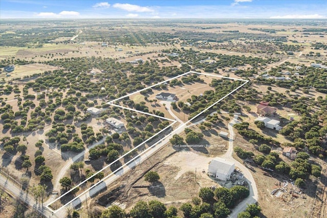 birds eye view of property with a rural view and a desert view