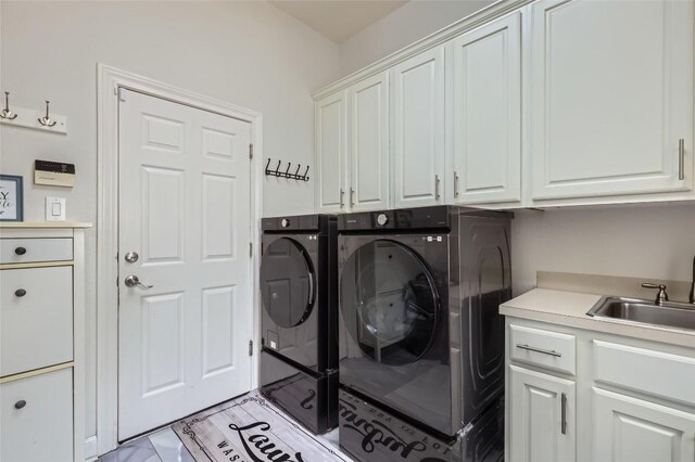 4514 Harvey Penick Dr, Round Rock, TX 78664 - washroom with cabinet space and washing machine and dryer