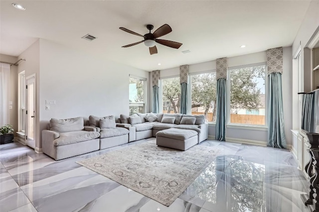 living area with recessed lighting, a ceiling fan, visible vents, and marble finish floor