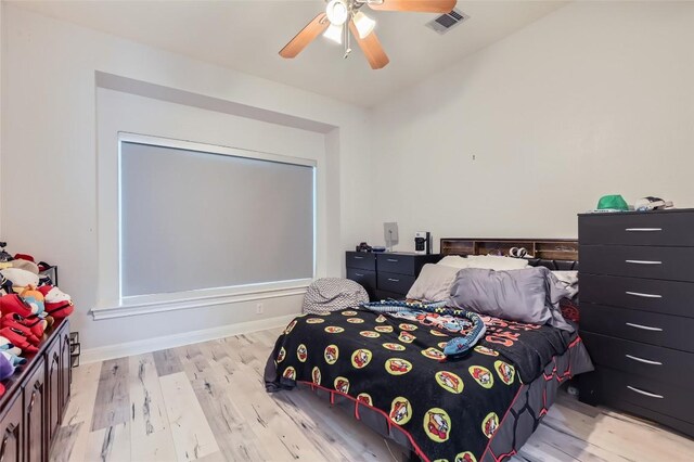 4514 Harvey Penick Dr, Round Rock, TX 78664 - bedroom with light wood-type flooring and a ceiling fan