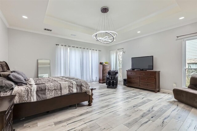 4514 Harvey Penick Dr, Round Rock, TX 78664 - bedroom featuring a tray ceiling, a chandelier, multiple windows, light wood-style floors, and ornamental molding