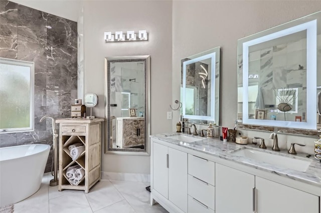 4514 Harvey Penick Dr, Round Rock, TX 78664 - bathroom with double vanity and a freestanding bath