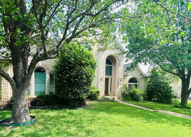 4514 Harvey Penick Dr, Round Rock, TX 78664 - view of front facade with stone siding and a front lawn