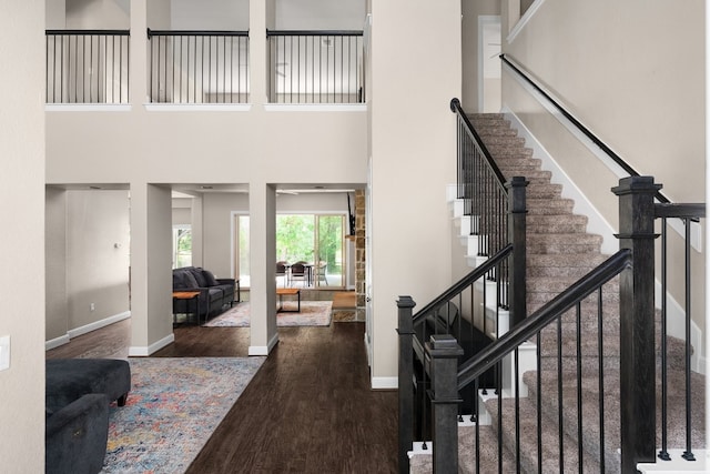 397 Arapaho Dr, Kyle, TX 78640 - interior space featuring baseboards, wood finished floors, and a towering ceiling