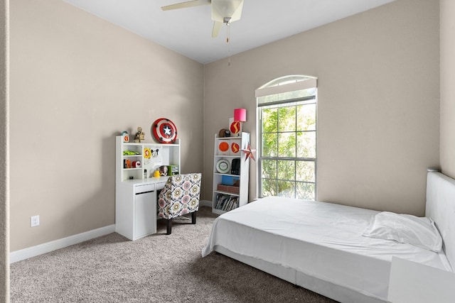397 Arapaho Dr, Kyle, TX 78640 - bedroom featuring baseboards, carpet floors, and ceiling fan
