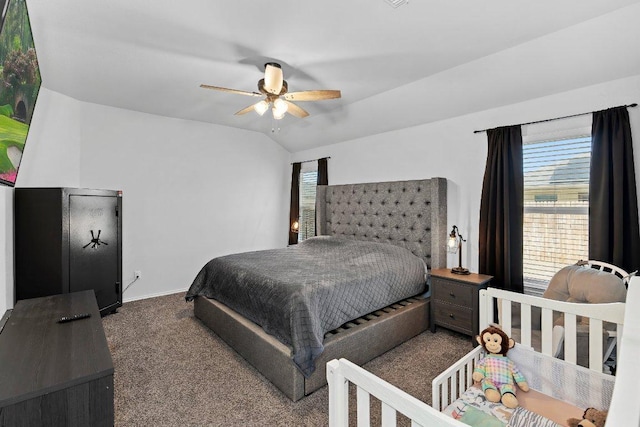 carpeted bedroom featuring lofted ceiling, a ceiling fan, and baseboards