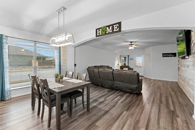 dining area featuring visible vents, ceiling fan, and wood finished floors