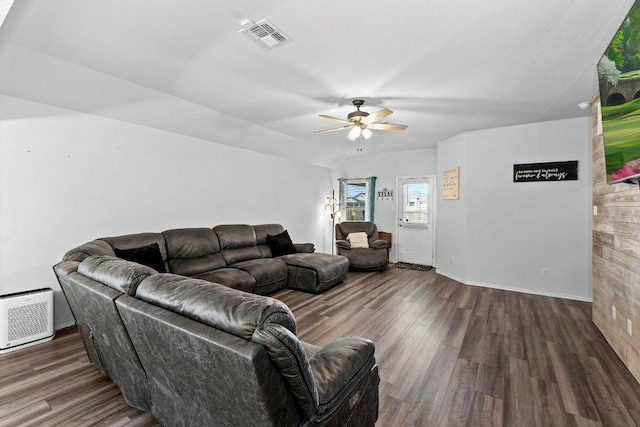 living area with visible vents, baseboards, ceiling fan, and wood finished floors