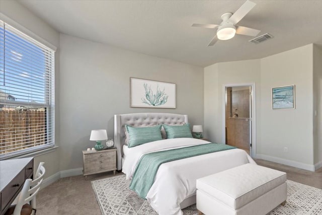 bedroom featuring visible vents, carpet floors, baseboards, and a ceiling fan