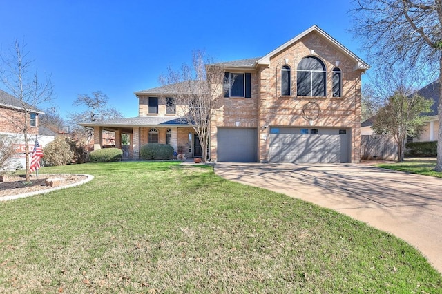 traditional-style home with brick siding, an attached garage, driveway, and a front lawn