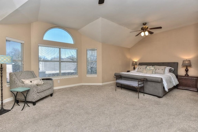 carpeted bedroom with vaulted ceiling, baseboards, and ceiling fan