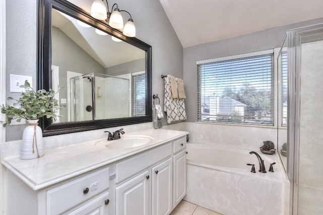 bathroom with vanity, vaulted ceiling, a shower stall, tile patterned floors, and a bath