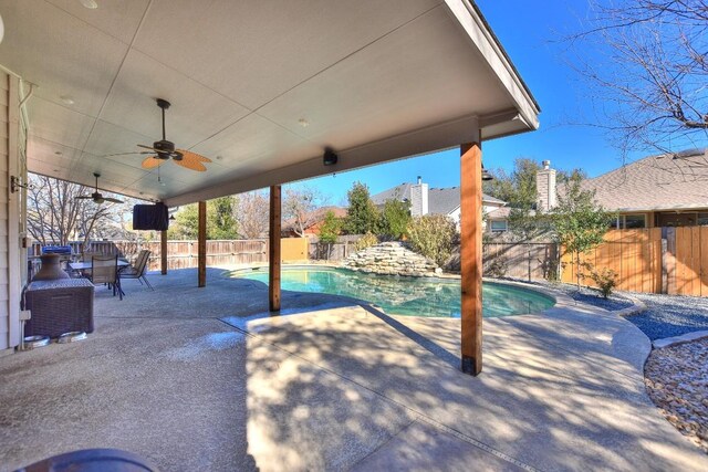 view of patio / terrace with a fenced backyard, a fenced in pool, and ceiling fan