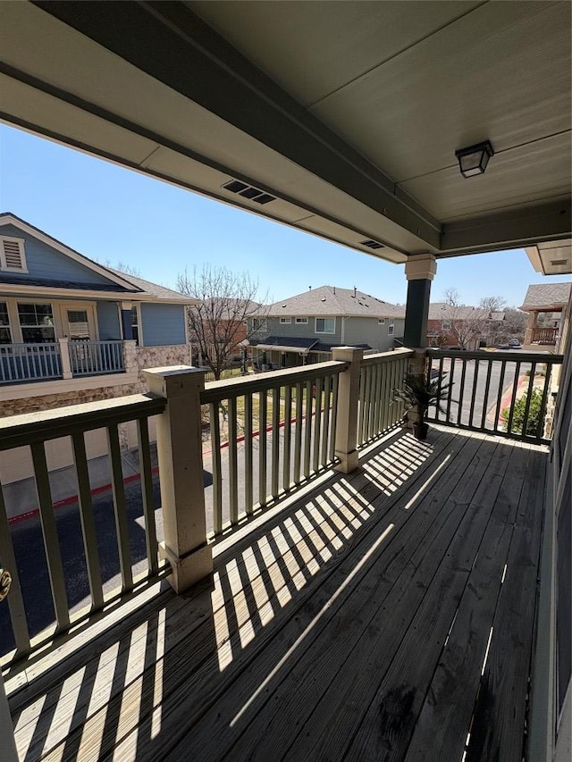 wooden terrace with a residential view