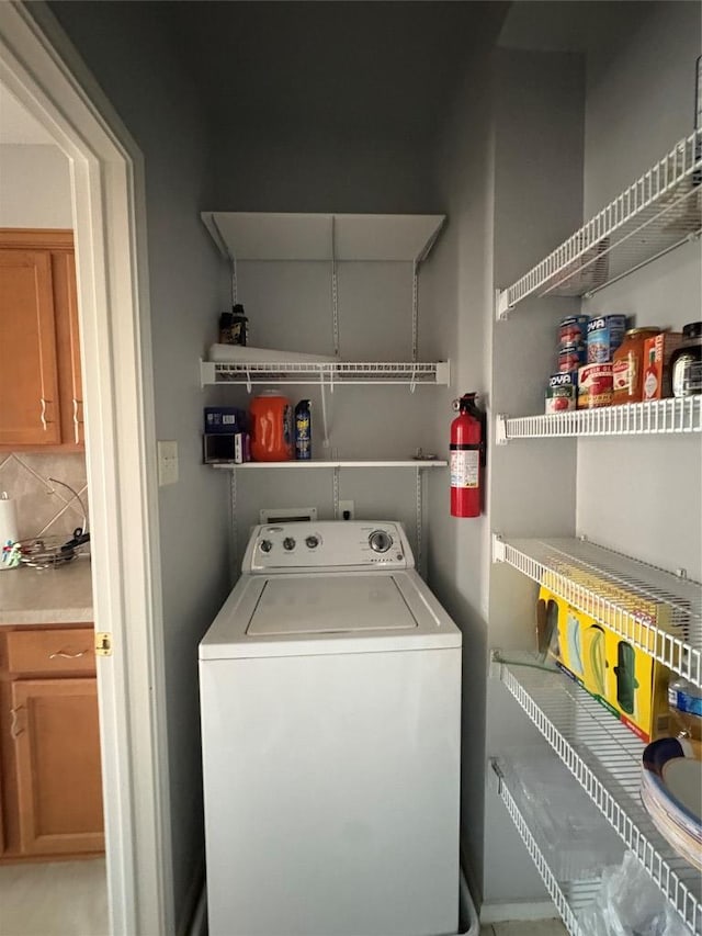 washroom featuring washer / clothes dryer and laundry area