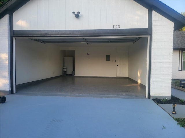 garage with freestanding refrigerator