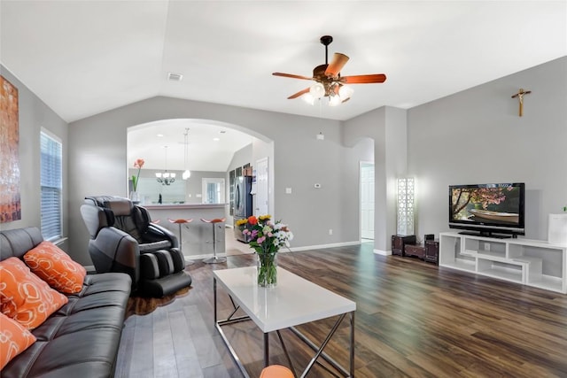 2700 Tumbling River Dr, Leander, TX 78641 - living area with lofted ceiling, wood finished floors, arched walkways, a ceiling fan, and baseboards