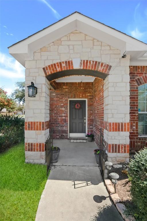 2700 Tumbling River Dr, Leander, TX 78641 - entrance to property with brick siding and a porch