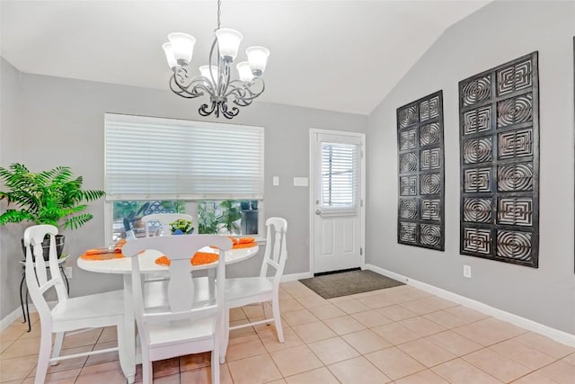 2700 Tumbling River Dr, Leander, TX 78641 - dining area with a chandelier, vaulted ceiling, baseboards, and light tile patterned flooring