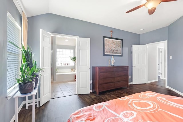 2700 Tumbling River Dr, Leander, TX 78641 - bedroom featuring wood finished floors, vaulted ceiling, ensuite bathroom, baseboards, and a ceiling fan