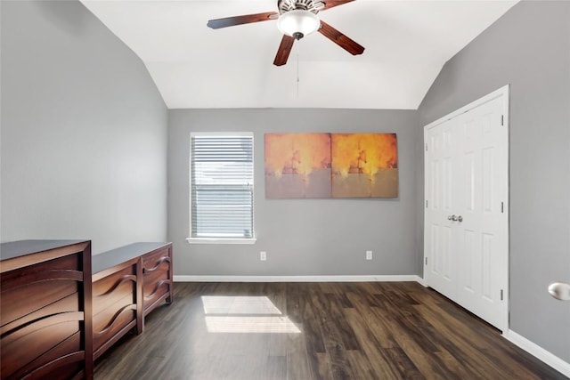 2700 Tumbling River Dr, Leander, TX 78641 - unfurnished bedroom with vaulted ceiling, dark wood-style floors, and baseboards