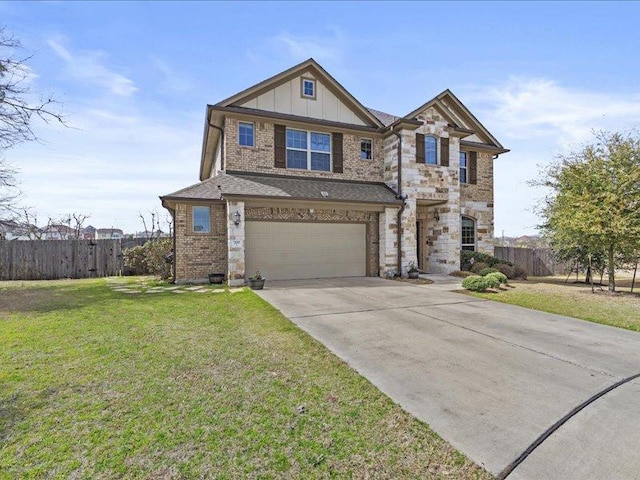 view of front of property with a front yard, fence, concrete driveway, a garage, and board and batten siding