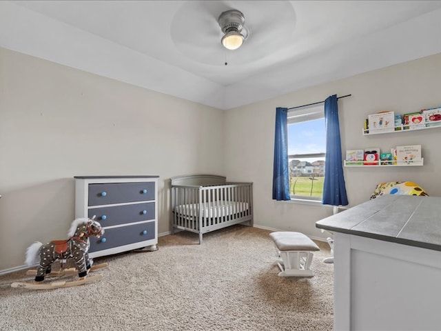 bedroom with baseboards, a ceiling fan, and carpet flooring