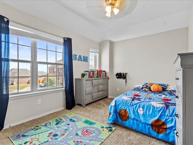 bedroom featuring a ceiling fan, baseboards, and carpet floors