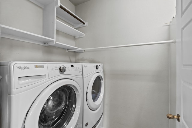 clothes washing area featuring laundry area and separate washer and dryer