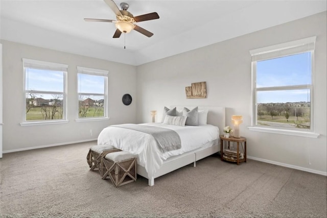 bedroom with baseboards, carpet, and a ceiling fan