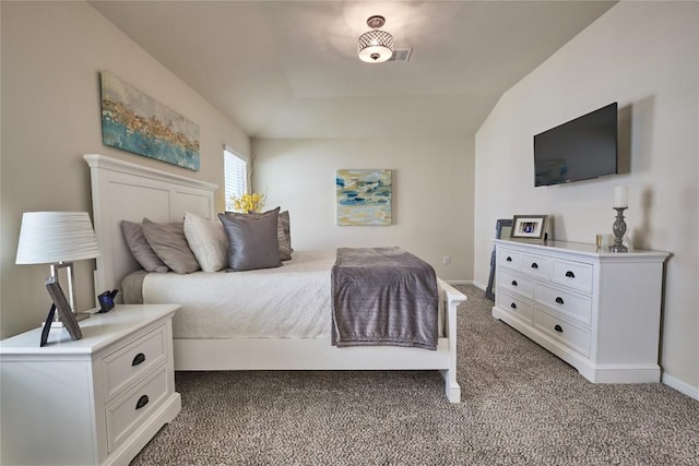 carpeted bedroom featuring baseboards and visible vents