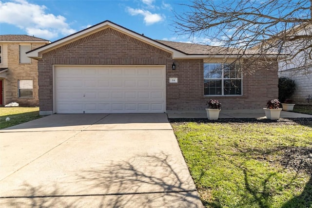 single story home featuring a front yard, a garage, brick siding, and driveway