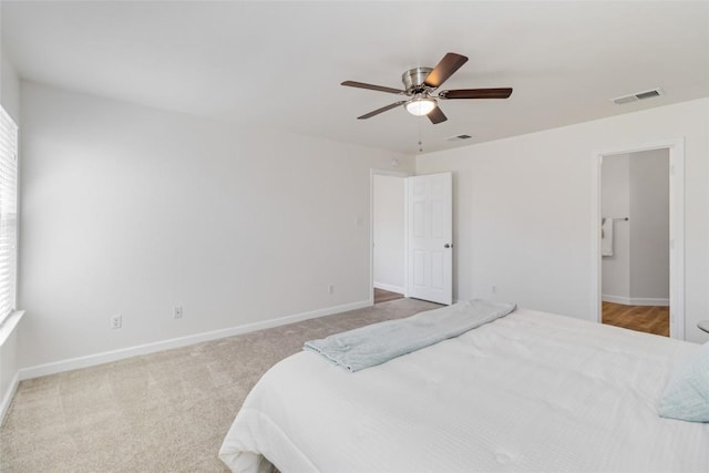 bedroom with visible vents, carpet flooring, baseboards, and ceiling fan