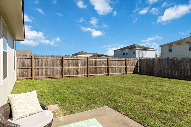 view of yard with a fenced backyard