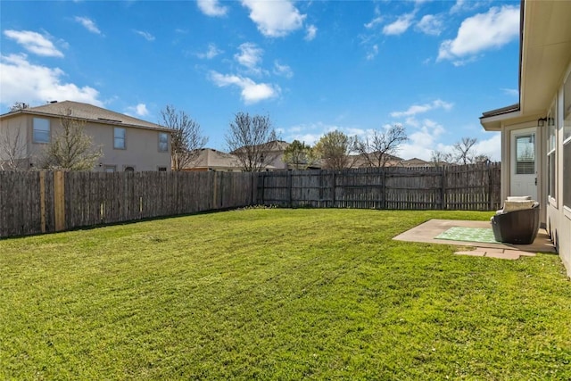 view of yard featuring a patio and a fenced backyard