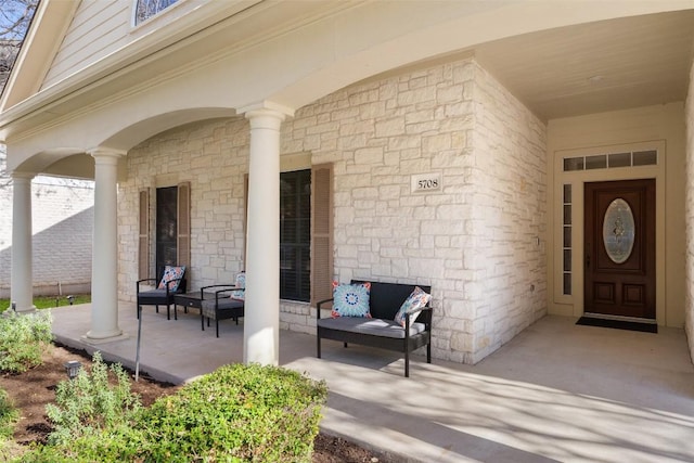 doorway to property featuring covered porch