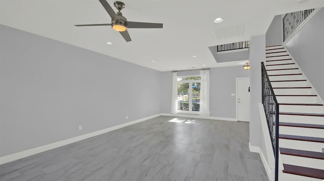 unfurnished living room featuring visible vents, a ceiling fan, recessed lighting, stairway, and baseboards