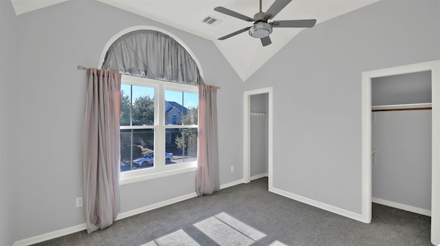 unfurnished bedroom with visible vents, carpet, baseboards, ceiling fan, and vaulted ceiling