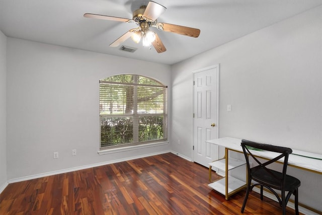 unfurnished office with visible vents, baseboards, wood finished floors, and a ceiling fan