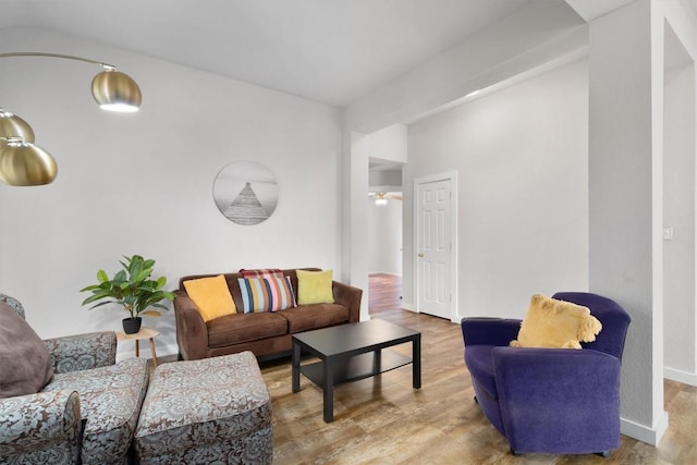 living room with baseboards and wood finished floors