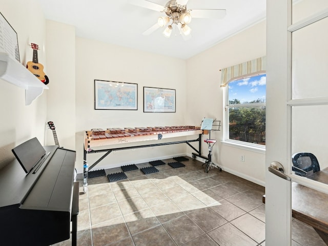 bathroom with tile patterned floors, baseboards, and a ceiling fan