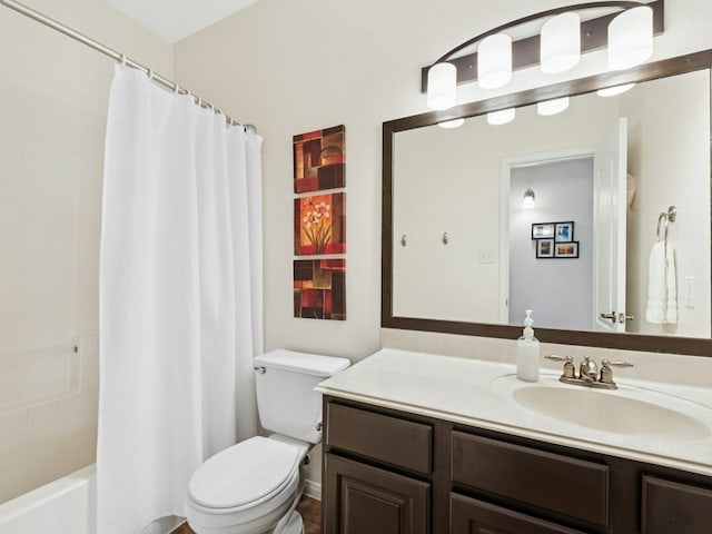 bathroom with vanity, shower / bath combination with curtain, and toilet