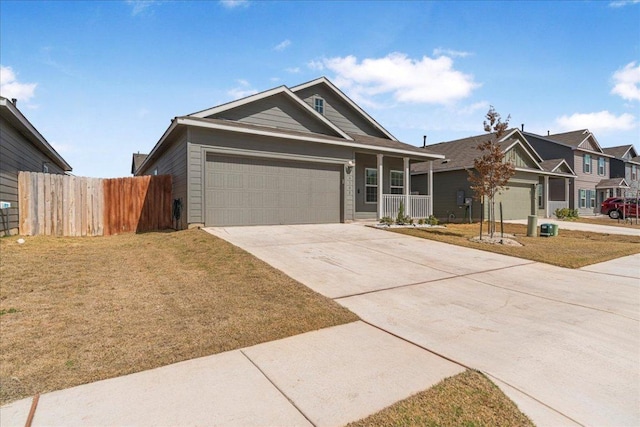 single story home featuring driveway, a front lawn, a garage, and fence