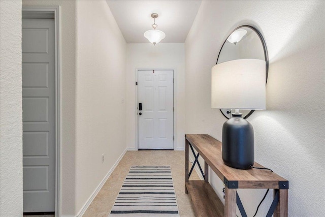 entryway featuring baseboards