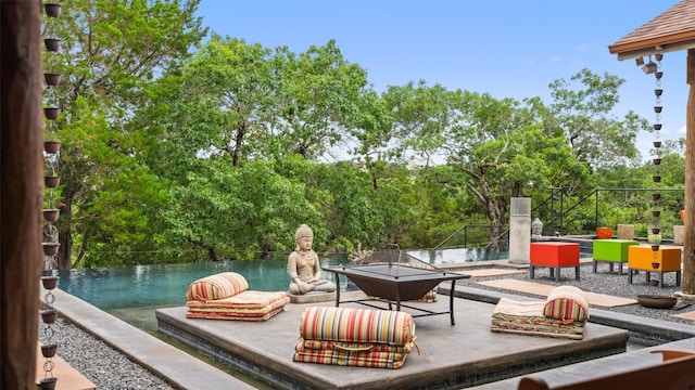 view of patio / terrace featuring a fire pit